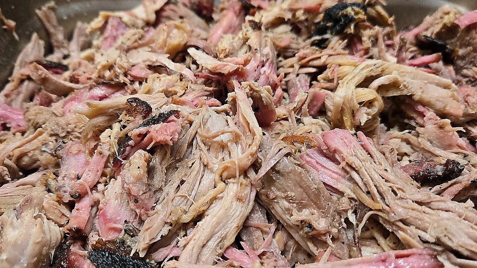 Close up texture of pulled pork with bark