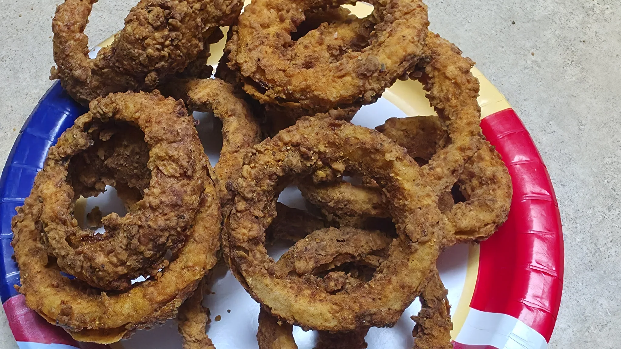 Finished measured batch of dark golden extreme-heat onion rings